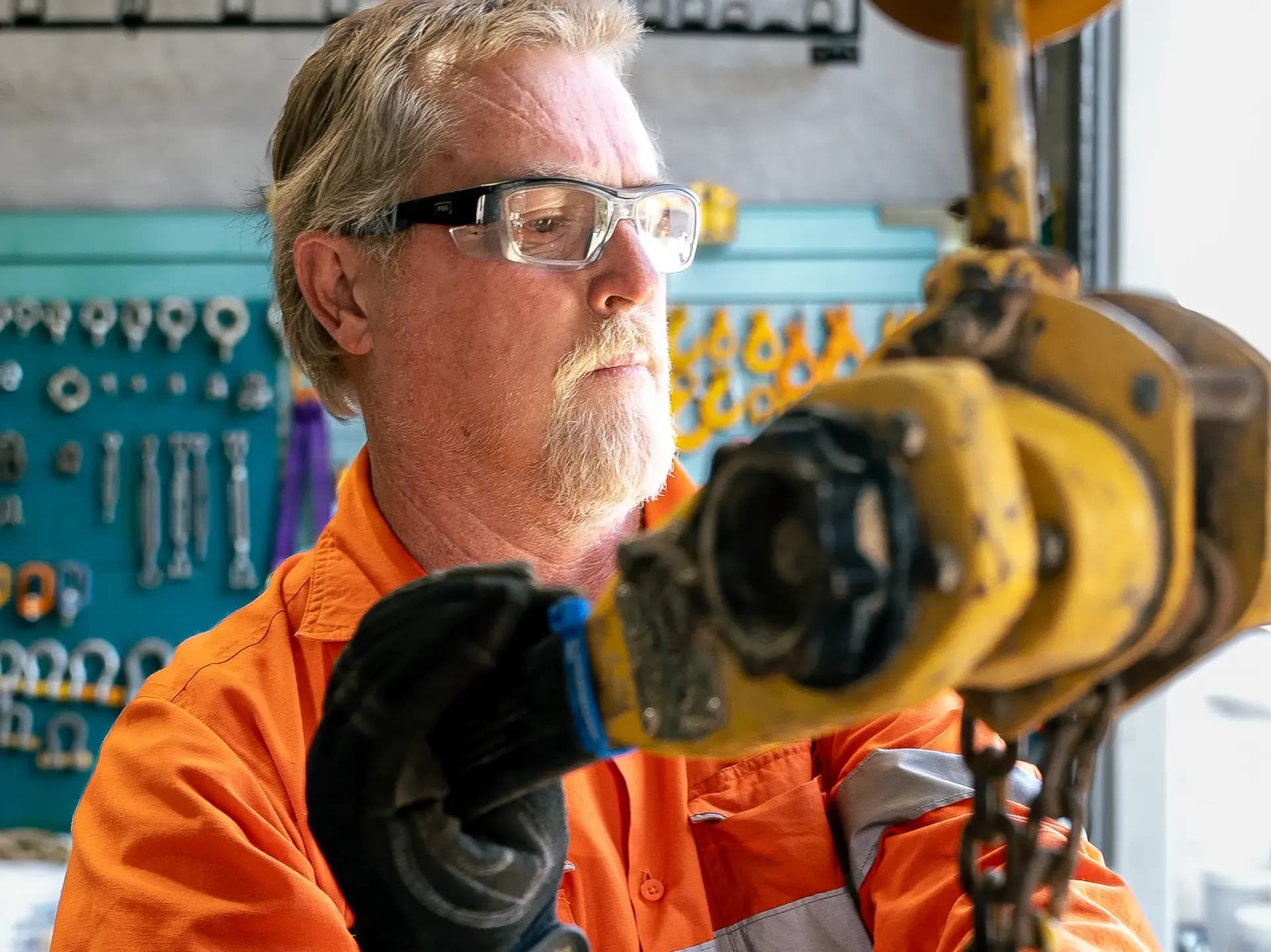 Technician inspecting a chain block